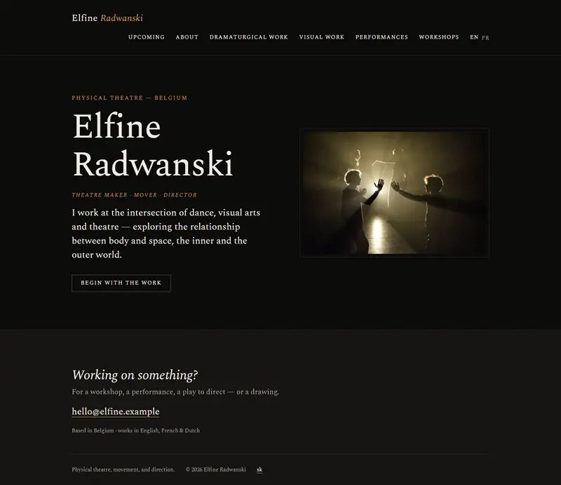 Elfine's site on a desktop: her name in a light serif on near-black, 'physical theatre — Belgium' above it and 'theatre maker · mover · director' below, beside a photograph of two performers reaching towards a single stage light.
